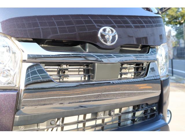 ハイエースバン スーパーＧＬ　ダークプライムＩＩ　トヨタ純正ＳＤナビ　バックカメラ　ＥＴＣ　ドライブレコーダー前後　ＴＲＤフロントスポイラー　ＴＲＤマッドガード　ＴＲＤサイドスカート　ＴＯＹＯオープンカントリーＡＴ１５インチ　トヨタ純正アルミホイール（22枚目）