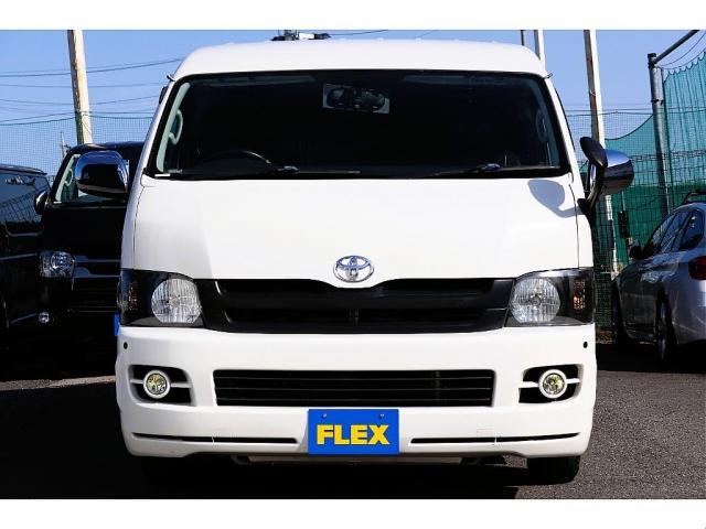 レジアスエースバン ロングワイドスーパーGL フローリング施工 バタフライセカンドシート ベットキット 防虫ネット ルームキャリア シートカバー イクリプスナビ 後席フリップダウンモニター ETC インナーブラックヘッドライト(6枚目)