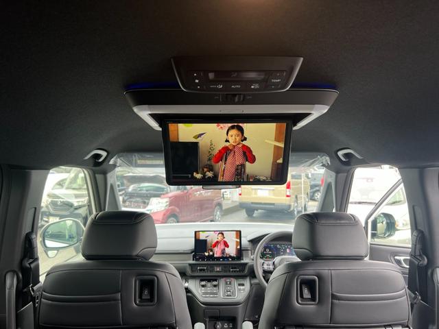 ステップワゴン e:HEVスパーダ/走行10KM/デーラーOPデカナビ 両側パワースライドドア/ハーフレザーシート/電動リアゲート/CDDVD再生/12セグ/BT/アラウンドビューモニター/フリップダウンモニター/LEDヘッドライト/フォグ/スマートキー/プッシュスタート(25枚目)