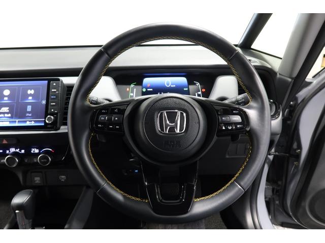 フィット ｅ：ＨＥＶＲＳ　ホンダ認定中古車　２年保証　デモカー　禁煙車　運転支援　衝突軽減ブレーキ（ＣＭＢＳ）　誤発進抑制機能　渋滞追従付クルコン（ＡＣＣ）　ドラレコ　コネクトナビ　バックカメラ　ＥＴＣ　フルセグＴＶ　ＵＳＢ（15枚目）