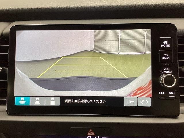 フィット ｅ：ＨＥＶホーム　２０周年特別仕様車　カーサ　ドライブレコーダー　バックカメラ　ナビ　ＴＶ　クリアランスソナー　オートクルーズコントロール　レーンアシスト　衝突被害軽減システム　アルミホイール　オートライト　ＬＥＤヘッドランプ　スマートキー（4枚目）