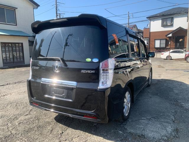 ステップワゴンスパーダ Z BTオーディオ 横滑防止 イモビ スマキー フルフラットシート キーフリー パワーウィンド ETC付 運転席助手席エアバック エアバック 衝突安全ボディ AUTOライト ABS Wエアコン PS(3枚目)