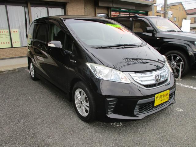 フリードハイブリッド ジャストセレクション 15インチアルミ バックカメラ HIDヘッドランプ 純正セキュリティー ETC Bluetooth 取説 メンテナンスノート HDD フルセグTV DVD CD キーレスECON 片側電動スライドドア(6枚目)