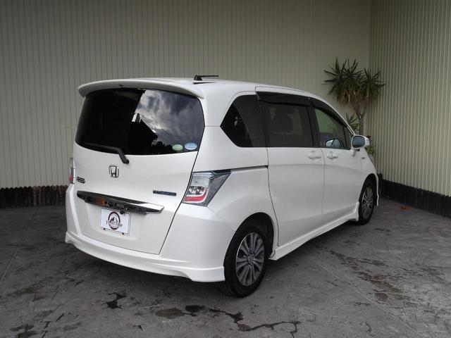 フリードハイブリッド ジャストセレクション　６人乗り／両側電動ドア／ハーフレザーシート／純正アルミホイール／イクリプスナビ／ＴＶ／ＢＴ／バックカメラ／ＥＴＣ／プレミアムホワイト・パール／禁煙車（7枚目）