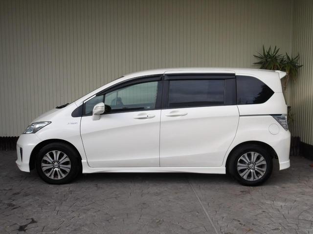 フリードハイブリッド ジャストセレクション　６人乗り／両側電動ドア／ハーフレザーシート／純正アルミホイール／イクリプスナビ／ＴＶ／ＢＴ／バックカメラ／ＥＴＣ／プレミアムホワイト・パール／禁煙車（9枚目）