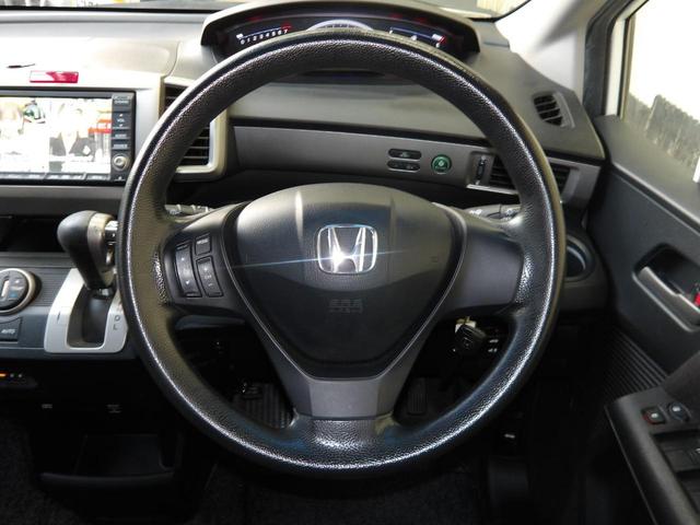 フリード Ｇ　エアロ　ジャストセレクション　２２年１２月登録／純正エアロ／プレミアムホワイト・パール／電動スライドドア／純正ＨＤＤインターナビ／ＴＶ／ＤＶＤビデオ／バックカメラ／ＥＴＣ／７人乗り／禁煙車／修復歴無し（27枚目）