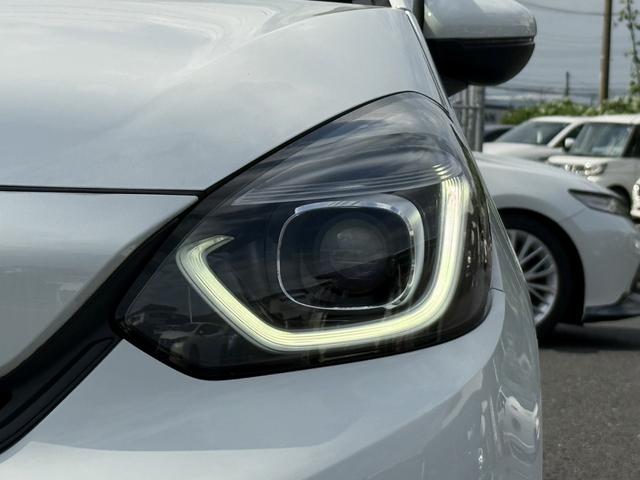 フィット ｅ：ＨＥＶベーシック　社外ナビ／ＳＤオーディオ／レーダークルーズ／ＬＥＤ／コーナーセンサー／衝突軽減／スマートキー／プッシュスタート／（27枚目）