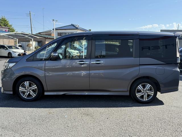 ステップワゴンスパーダ スパーダハイブリッド G ホンダセンシング 禁煙車 1オーナー 純正10インチナビ 後席モニター バックカメラ フルセグ 両側電動スライド 7人乗リ 衝突軽減ブレーキ ダダクティブクルーズ わくわくゲート デュアルエアコン レーンキープアシスト(14枚目)