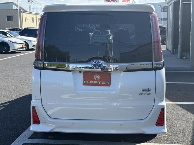 ノア ハイブリッドＳｉ　禁煙車　純正１０．５インチナビ　後席モニター　両側電動スライドドア　寒冷地仕様　リアオートエアコン　バックカメラ　７人乗り　衝突軽減ブレーキ　純正１６インチＡＷ　シートヒーター　ＥＴＣ　ハーフレザー（12枚目）