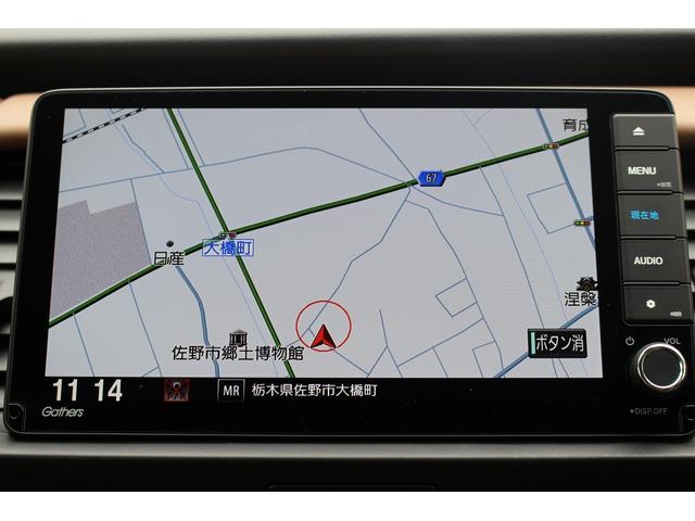 フィット ｅ：ＨＥＶリュクス　禁煙車　純正９インチナビ　バックカメラ　茶革ハーフレザー　シートヒーター　衝突軽減ブレーキ　アダクティブクルーズ　レーンキープ　純正１６インチアルミホイール　フルセグ　Ｂｌｕｅｔｏｏｔｈ接続　ＥＴＣ（3枚目）