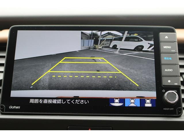 フィット ｅ：ＨＥＶリュクス　禁煙車　純正９インチナビ　バックカメラ　茶革ハーフレザー　シートヒーター　衝突軽減ブレーキ　アダクティブクルーズ　レーンキープ　純正１６インチアルミホイール　フルセグ　Ｂｌｕｅｔｏｏｔｈ接続　ＥＴＣ（5枚目）