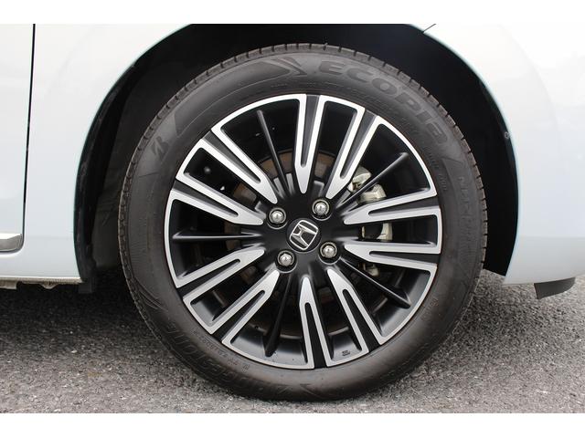 フィット ｅ：ＨＥＶリュクス　禁煙車　純正９インチナビ　バックカメラ　茶革ハーフレザー　シートヒーター　衝突軽減ブレーキ　アダクティブクルーズ　レーンキープ　純正１６インチアルミホイール　フルセグ　Ｂｌｕｅｔｏｏｔｈ接続　ＥＴＣ（14枚目）