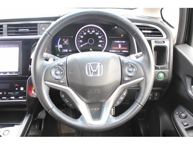 シャトル ハイブリッドＸ　ホンダセンシング　禁煙車　メーカーＯＰ８型ナビ　フルセグ　バックカメラ　ハーフレザー　アダクティブクルーズコントロール　衝突軽減　シートヒーター　純正１５インチＡＷ　ＥＴＣ　レーンアシスト　Ｂｌｕｅｔｏｏｔｈ接続（18枚目）