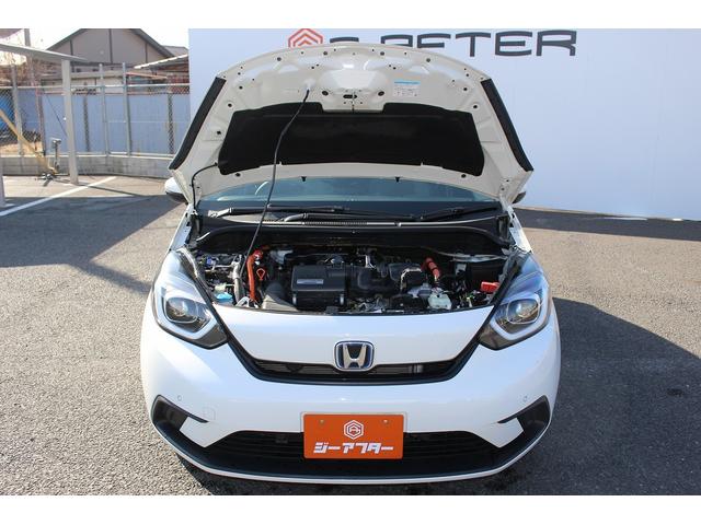 フィット ｅ：ＨＥＶベーシック　禁煙車　ホンダセンシング　社外ナビ　衝突軽減ブレーキ　運転支援システム　ホールドブレーキ　ビルドインＥＴＣ　車線逸脱警報　アダプティブクルーズコントロール　Ｂｌｕｅｔｏｏｔｈ接続　コーナーセンサー（69枚目）
