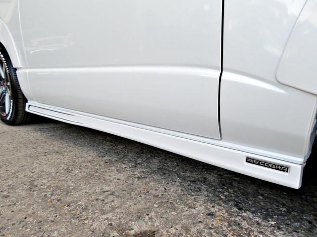 ハイエースバン スーパーGL ダークプライムII 新車未登録/7型/6AT/2800ccディーゼルターボ/415コブラフルエアロ/18インチAW/両側出しマフラーカッター/ワイパーカウル/ルーフスポイラー/イエローキャリパーカバー/フルセグTV/(34枚目)