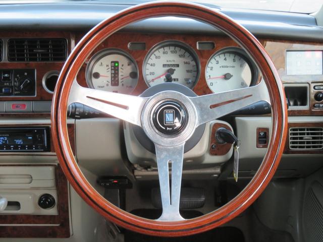 ラシーン ｆｔ　タイプＳ　下取り車　４ＷＤ　木目調パネル　ナルディハンドル　レザー調シートカバー　キーレス　１ＤＩＮオーディオ　ＥＴＣ　電動格納ミラー　タイミングチェーン　社外ホイール　背面タイヤ（39枚目）