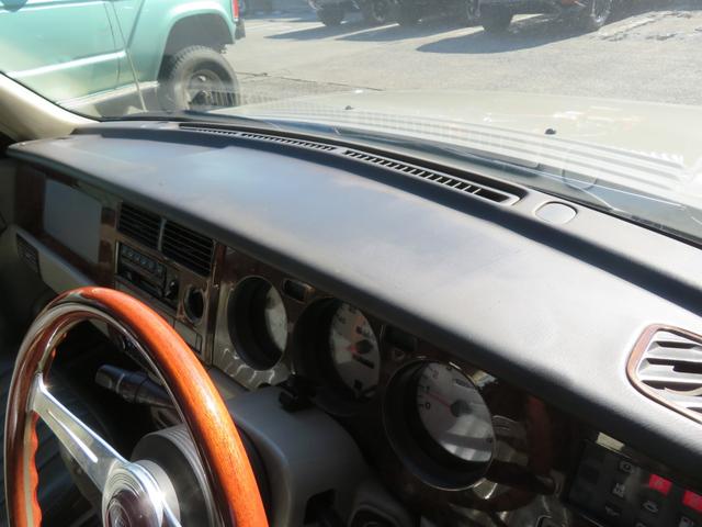 ラシーン ｆｔ　タイプＳ　下取り車　４ＷＤ　木目調パネル　ナルディハンドル　レザー調シートカバー　キーレス　１ＤＩＮオーディオ　ＥＴＣ　電動格納ミラー　タイミングチェーン　社外ホイール　背面タイヤ（40枚目）