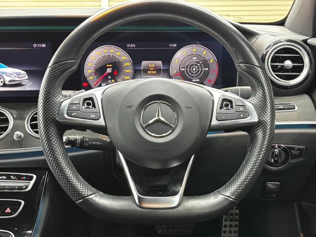 Ｅクラス Ｅ４３　４マチック　レーダーセーフティパッケージ　ヘッドアップディスプレイ　黒レザーシート　純正ナビ　３６０°カメラ　パワーシート　シートヒーター　アンビエントライト　ブルメスター　フルセグＴＶ　パワーバックドア（23枚目）