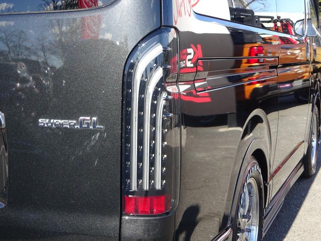 ハイエースバン スーパーGL ダークプライム ワンオーナー車/415コブラフルエアロ/バッドフェイスボンネット/415コブラバッドテール/415コブラバッドラッカー17インチナスカー/スライドレール付後部座席/ベッドキット/両側パワースライドドア(47枚目)