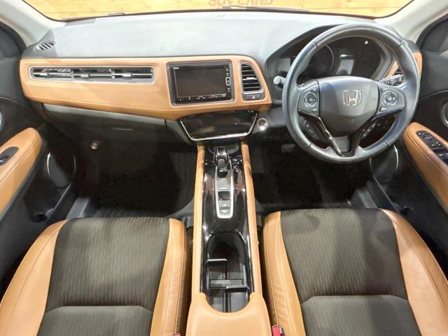 ヴェゼル ハイブリッドZ・ホンダセンシング 禁煙 純正ナビ バックカメラ レーダークルーズコントロール ETC シートヒーター ルーフレール LEDヘッドライト 純正17インチアルミ ハーフレザーシート フルセグ DVD&CD Bluetoot(2枚目)