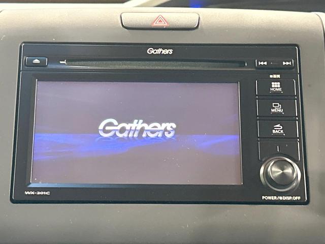 フリードハイブリッド ハイブリッド・Gホンダセンシング 禁煙 ディスプレイオーディオ バックカメラ 両側電動ドア シートヒーター ETC LEDヘッドライト レーダークルーズコントロール ハーフレザーシート 純正15インチアルミ 本革巻きステアリング(3枚目)