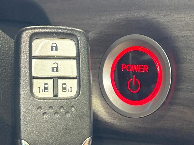 フリードハイブリッド ハイブリッド・Gホンダセンシング 禁煙 ディスプレイオーディオ バックカメラ 両側電動ドア シートヒーター ETC LEDヘッドライト レーダークルーズコントロール ハーフレザーシート 純正15インチアルミ 本革巻きステアリング(24枚目)