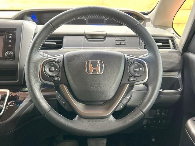 フリードハイブリッド ハイブリッド・Gホンダセンシング 禁煙 ディスプレイオーディオ バックカメラ 両側電動ドア シートヒーター ETC LEDヘッドライト レーダークルーズコントロール ハーフレザーシート 純正15インチアルミ 本革巻きステアリング(50枚目)