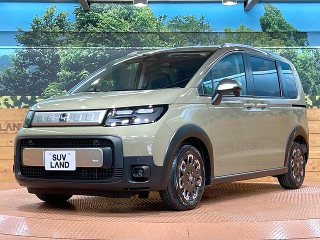 フリード ｅ：ＨＥＶクロスター　登録済未使用車　両側電動ドア　ルーフレール　ブラインドスポットモニター　レーダークルーズコントロール　シートヒーター　ホンダセンシング　ハーフレザーシート　純正１５インチＡＷ　ウォークスルー（53枚目）