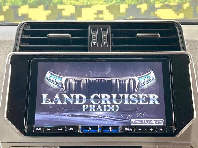 ランドクルーザープラド ＴＸ　Ｌパッケージ　マットブラックエディション　禁煙車　サンルーフ　９型ナビ　バックカメラ　レーダークルーズ　シートベンチレーション　オートマチックハイビーム　ＬＥＤヘッドライト　７人乗り　クリアランスソナー　シートヒーター　Ｂｌｕｅｔｏｏｔｈ（3枚目）