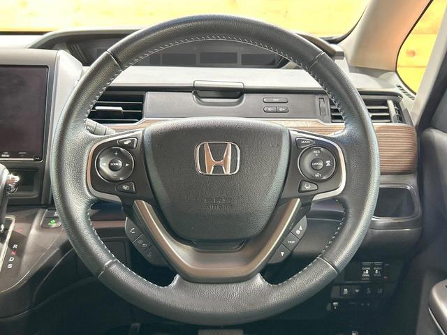 フリード クロスター・ホンダセンシング　禁煙車　両側電動ドア　純正ＳＤナビ　ホンダセンシング　クリアランスソナー　レーダークルーズ　ＬＥＤヘッドライト　バックカメラ　純正１５インチＡＷ　ウォークスルー　ＥＴＣ　オートエアコン　オートライト（12枚目）