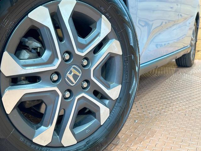 フリード クロスター・ホンダセンシング　禁煙車　両側電動ドア　純正ＳＤナビ　ホンダセンシング　クリアランスソナー　レーダークルーズ　ＬＥＤヘッドライト　バックカメラ　純正１５インチＡＷ　ウォークスルー　ＥＴＣ　オートエアコン　オートライト（14枚目）