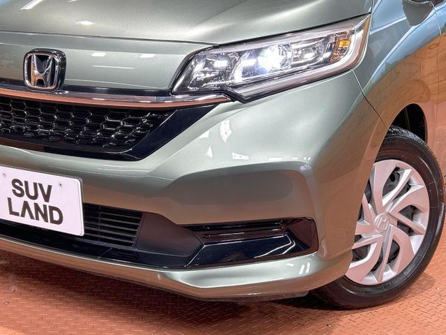 フリード G・ホンダセンシング 禁煙車 両側電動スライドドア ウォークスルー LEDヘッド バックカメラ 純正ナビ フルセグ レーダークルーズ フルセグ ETC クリアランスソナー レーンアシスト アイドリングストップ(12枚目)