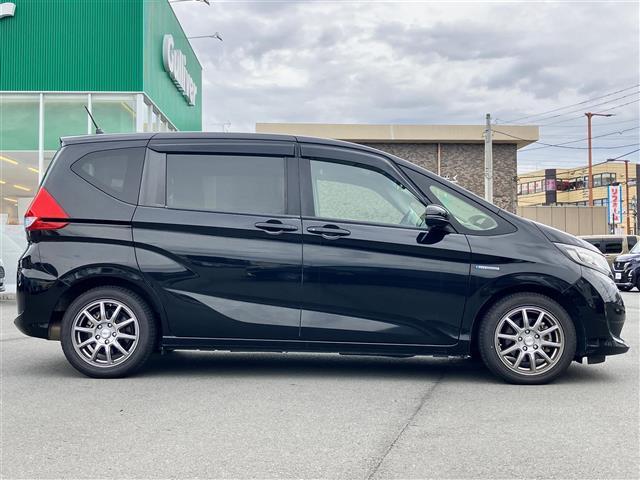 フリードハイブリッド ハイブリッド・EX 純正9インチナビ/バックカメラ/後席モニター/ドライブレコーダー/寒冷地仕様/レーダークルーズコントロール/ETC/D席N席シートヒーター/両側パワースライドドア/レーンキープアシスト/衝突軽減(8枚目)