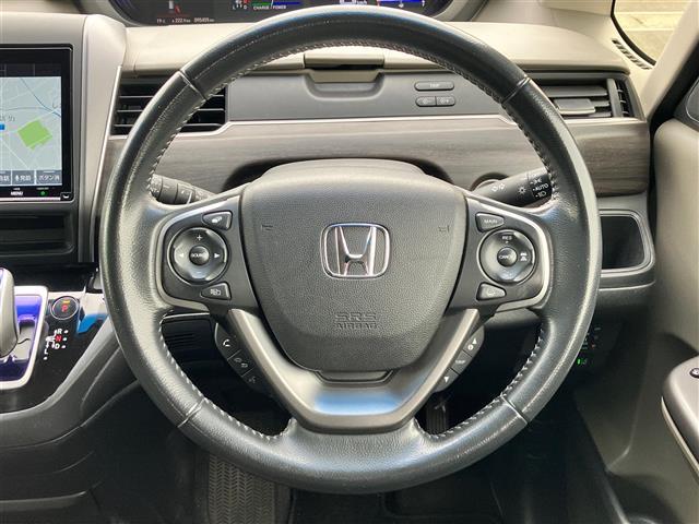 フリードハイブリッド ハイブリッド・EX 純正9インチナビ/バックカメラ/後席モニター/ドライブレコーダー/寒冷地仕様/レーダークルーズコントロール/ETC/D席N席シートヒーター/両側パワースライドドア/レーンキープアシスト/衝突軽減(11枚目)