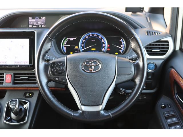 ヴォクシー ハイブリッドV 1オーナー モデリスタエアロ 9インチナビ TVキャンセラー 後席モニター Bluetooth LEDヘッドライト レーダー ドラレコ シートヒーター クルコン 片側電動スライド ETC バックカメラ(16枚目)