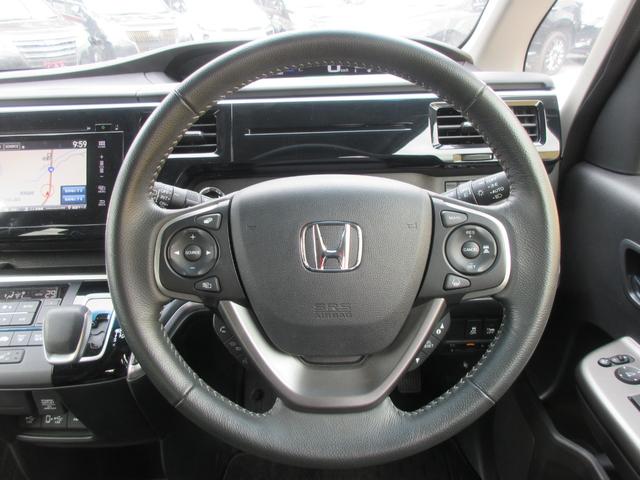 ステップワゴンスパーダ スパーダハイブリッド　Ｇ・ＥＸ　ホンダセンシング　後席フリップダウンモニター　ホンダセンシング　レーダークルーズコントロール　アラウンドビューモニター　純正ナビ　Ｂｌｕｅｔｏｏｔｈ　フルセグＴＶ　両側パワースライドドア　シートヒーター　オートライト（12枚目）