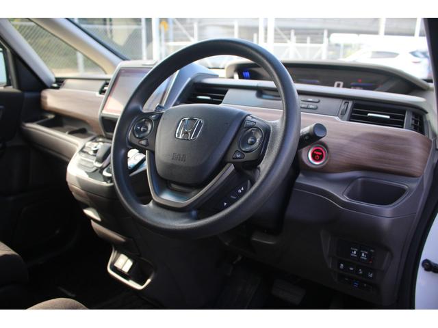 フリード+ハイブリッド ハイブリッドG 1オーナー 純正9型ナビ フルセグテレビ バックカメラ 両側電動スライドドア 衝突軽減ブレーキ 温熱シート LEDヘッドライト ETC スマートキー プッシュスタート(23枚目)