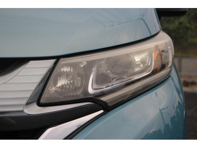 フリード＋ハイブリッド ハイブリッドＥＸ　純正９インチナビ　禁煙車　フルセグＴＶ　純正フリップダウンモニター　ＬＥＤヘッドライト　両側電動スライドドア　バックカメラ　シートヒーター　ハーフレザーシート　衝突軽減ブレーキ　レーンアシスト（19枚目）