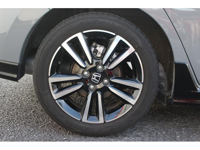 フィット ｅ：ＨＥＶ　ＲＳ　後期型　禁煙車　純正９型ナビ　フルセグＴＶ　バックカメラ　ハーフレザーシート　ＬＥＤヘッドライト　レーダークルーズコントロール　純正１６インチホイール　ＥＴＣ　衝突軽減ブレーキ　Ｂｌｕｅｔｏｏｔｈ接続（27枚目）