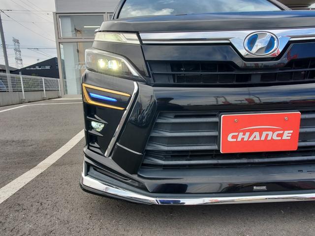 ヴォクシー ハイブリッドＺＳ　煌　純正１０インチナビ　フルセグ　ＣＤ　ＤＶＤ　Ｂｌｕｅｔｏｏｔｈ　バックカメラＥＴＣ　両側パワースライドドア　純正１２．８インチフリップダウンモニター　クルーズコントロール　前席シートヒーター　ＬＥＤ（66枚目）