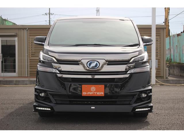 ヴェルファイアハイブリッド エグゼクティブラウンジ 禁煙車 フロントTRDエアロ サイド、リアモデリスタエアロ 純正10.5型JBLナビ 黒革シート 全周囲カメラ 後席モニター シートヒーター 衝突軽減ブレーキ パワーシート スマートキー(3枚目)