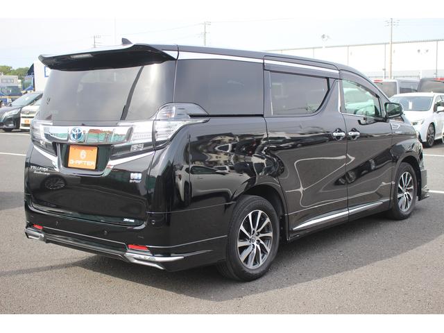 ヴェルファイアハイブリッド エグゼクティブラウンジ 禁煙車 フロントTRDエアロ サイド、リアモデリスタエアロ 純正10.5型JBLナビ 黒革シート 全周囲カメラ 後席モニター シートヒーター 衝突軽減ブレーキ パワーシート スマートキー(8枚目)