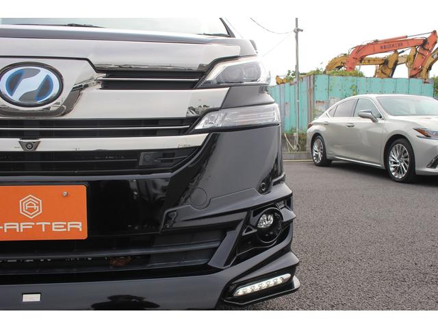 ヴェルファイアハイブリッド エグゼクティブラウンジ 禁煙車 フロントTRDエアロ サイド、リアモデリスタエアロ 純正10.5型JBLナビ 黒革シート 全周囲カメラ 後席モニター シートヒーター 衝突軽減ブレーキ パワーシート スマートキー(17枚目)