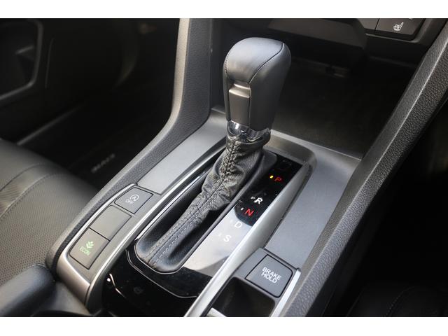 シビック ハッチバック　禁煙車　黒革シート　純正ナビ　フルセグＴＶ　バックカメラ　レーダークルーズコントロール　衝突軽減ブレーキ　ＬＥＤヘッドライト　シートヒーター　パワーシート　アイドリングストップ　電動格納ドアミラー（62枚目）