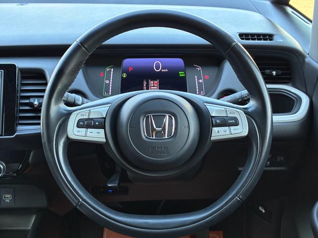 フィット e:HEVホーム 衝突軽減 レーンアシスト 純正ナビ CD DVD MSV Bluetooth接続 バックカメラ スマートキー ETC コーナーセンサー アダプティブクルコン LED オートハイビーム オートライト(12枚目)