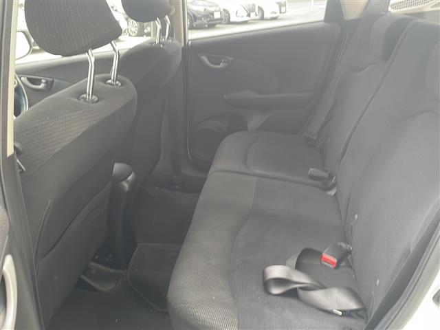 フィットハイブリッド ハイブリッド・10thアニバーサリー HDDナビ フルセグTV MSV DVD CD SD Bluetooth ETC クルーズコントロール スマートキー スペアキー フロアマット ドアバイザー ライトレベライザー 新車保証書 取扱説明書(23枚目)