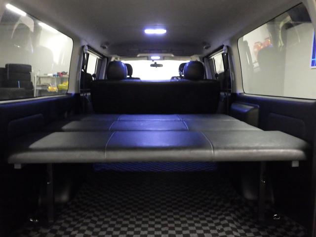 ハイエースバン ロングスーパーＧＬ　ワンオーナー　モデリスタエアロ　社外１５インチＡＷ　社外ＳＤナビ　バックカメラ　ＥＴＣ　ウッドコンビハンドル　ベッドキット　フェンダーカバー　ボンネットスポイラー　サイドエアロ　ローダウン（26枚目）