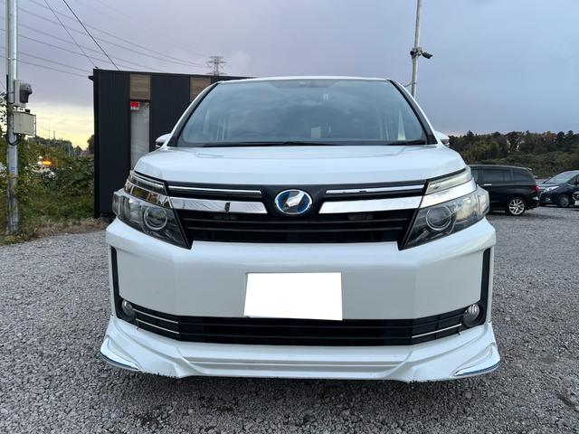 ヴォクシー ハイブリッドＶ　モデリスタエアロ両側電動ドアＬＥＤヘッドＥＴＣスマートキー　ＥＴＣ　オートクルーズコントロール　両側電動スライドドア　ＬＥＤヘッドランプ　スマートキー　電動格納ミラー　シートヒーター　３列シート（12枚目）