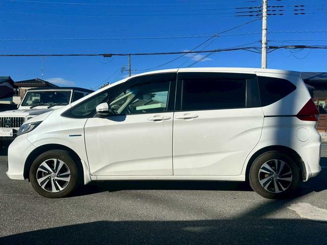 フリードハイブリッド ハイブリッド・Gホンダセンシング 純正9インチナビ フルセグTV バックモニター ETC 両側電動スライドドア ホンダセンシング シートヒーター 4WD(3枚目)