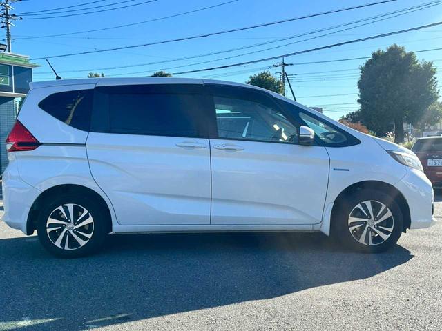 フリードハイブリッド ハイブリッド・Gホンダセンシング 純正9インチナビ フルセグTV バックモニター ETC 両側電動スライドドア ホンダセンシング シートヒーター 4WD(4枚目)